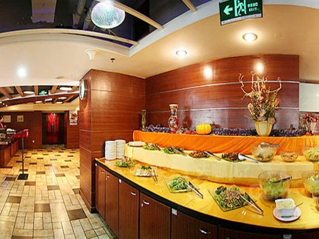 Tangyin Hotel Далиен Екстериор снимка