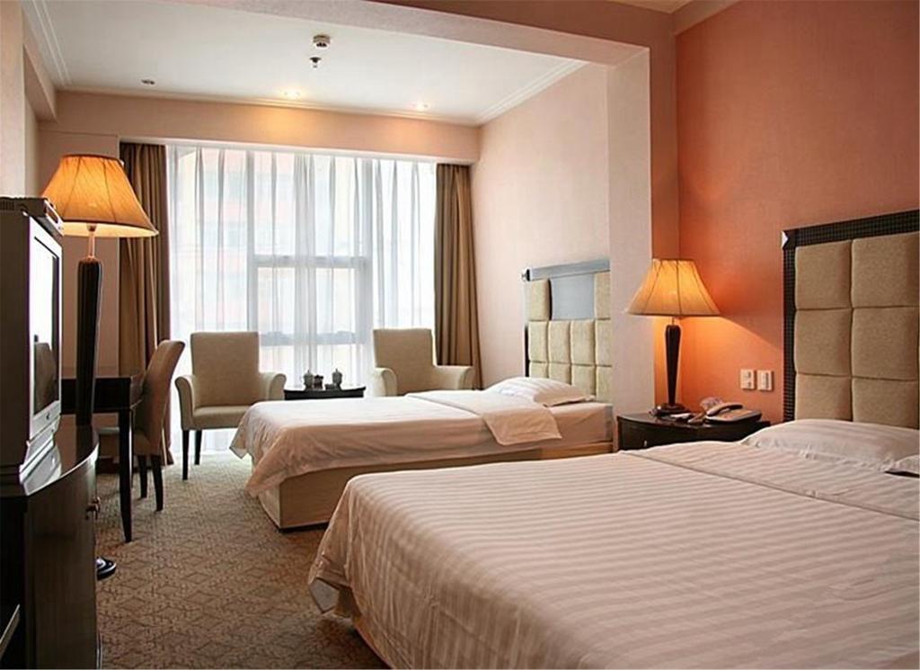 Tangyin Hotel Далиен Екстериор снимка